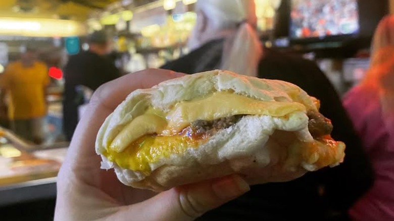 Charlie Boy sandwich being held by a hand at Miles Inn
