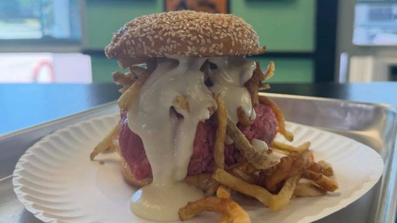 Roast Beef Sandwich known as the Uncle Buck with cheddar Mornay sauce and side of French fries from Bene's Beef