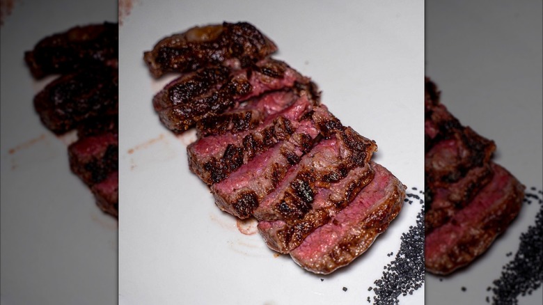 Cut wagyu steak on a white plate