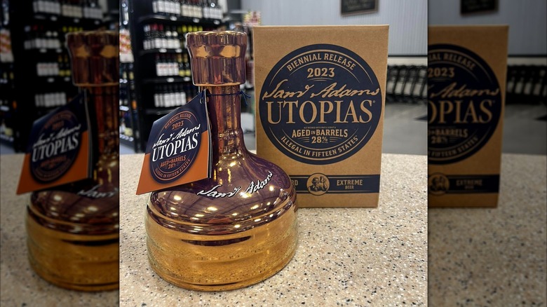 Sam Adams Utopias copper beer bottle on counter at liquor store