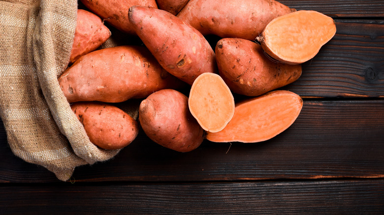 bag of raw sweet potatoes