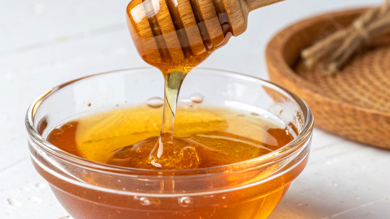 bowl of honey with dipper