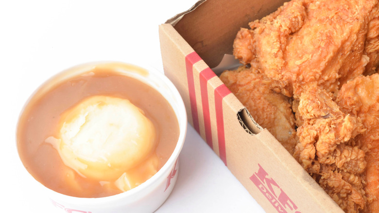KFC mashed potatoes with gravy and box of fried chicken