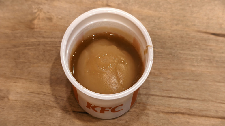 KFC mashed potatoes with gravy on a wooden table