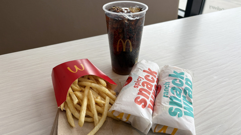 A McDonald's meal with fries, a soda, and two snack wraps.
