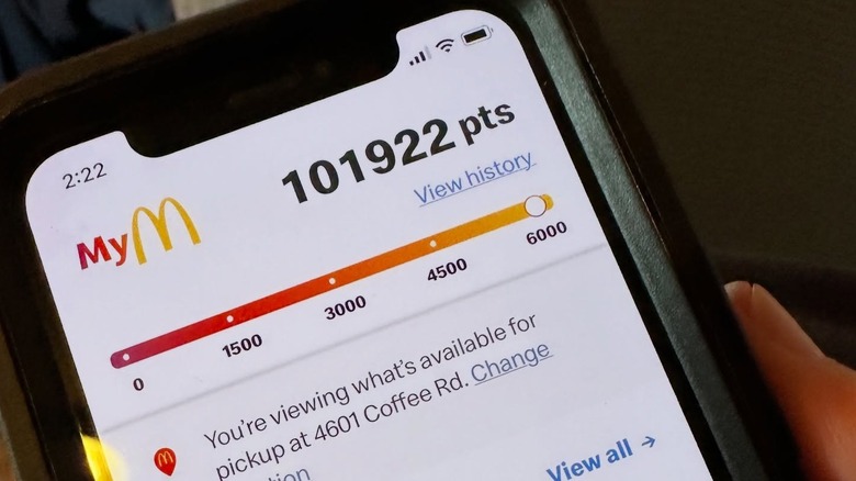 A smartphone running the McDonald's app, with 101922 pts showing.