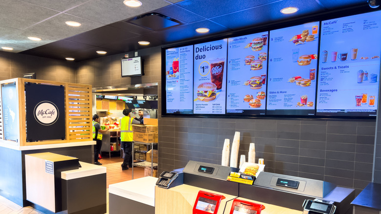 The register area and menu of a McDonald's restaurant.