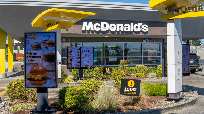 A McDonald's drive through with a digital menu.