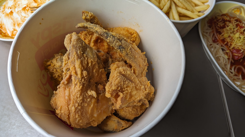 A top-down view of a Jollibee bucket of fried chicken.