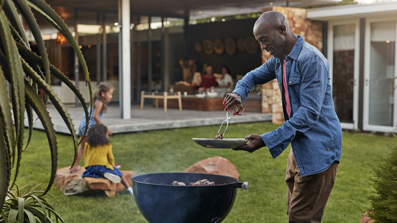 Man grilling during a family bbq