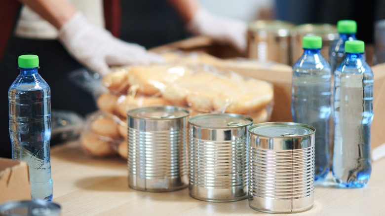 cans and bottled water with labels removed