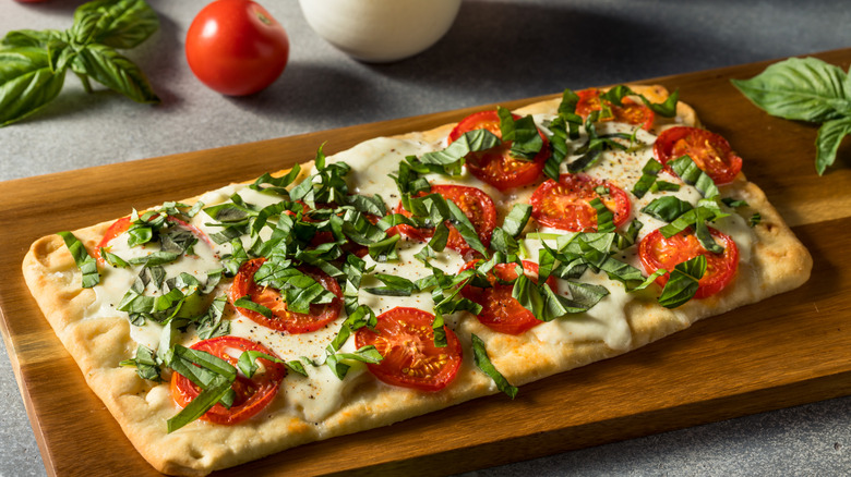 flatbread pizza with lots of basil