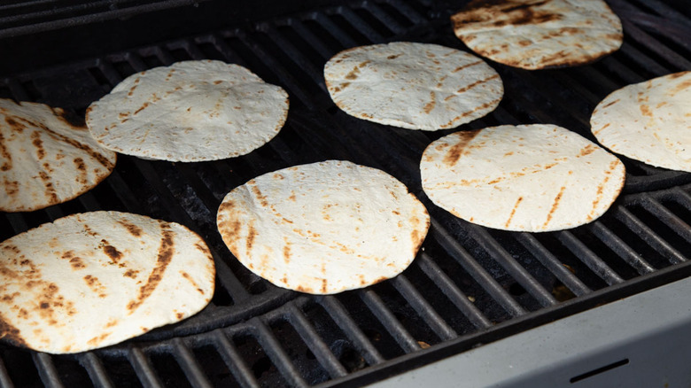 flour tortillas on a grill