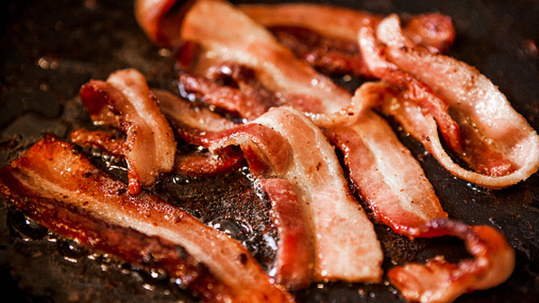 bacon frying in a pan