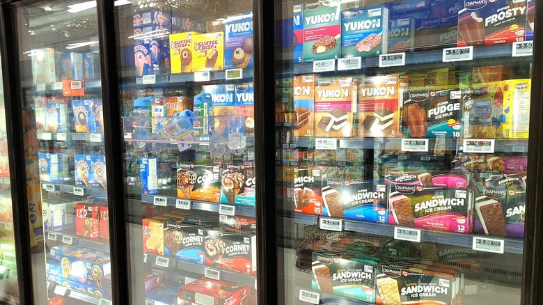 Various frozen desserts in freezer section at grocery store