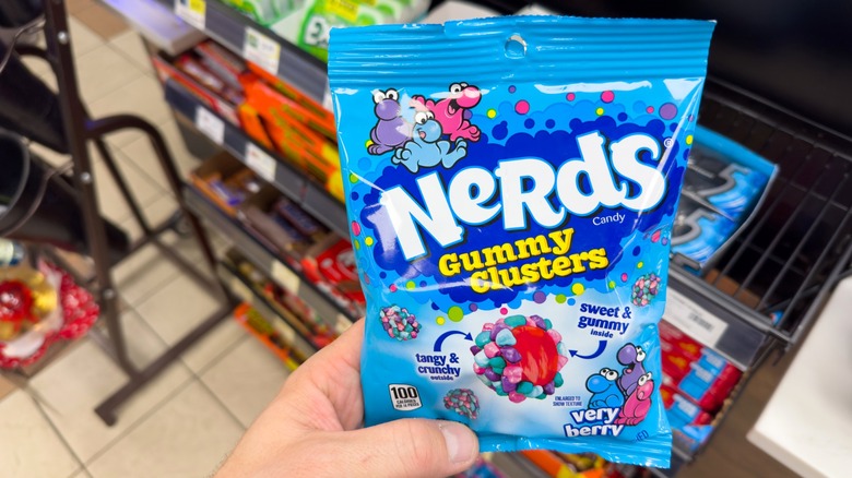 Person holding Very Berry Nerds Gummy Clusters package in store