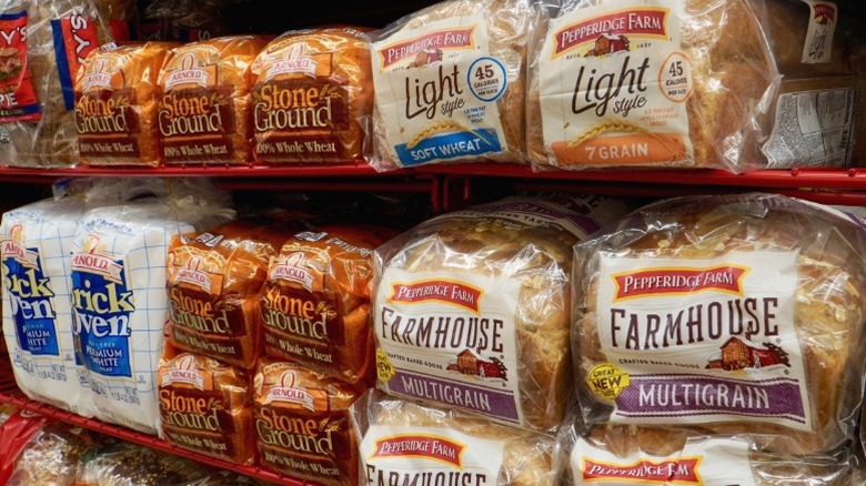 Loaves of bread for sale at the supermarket, including Pepperidge Farm.