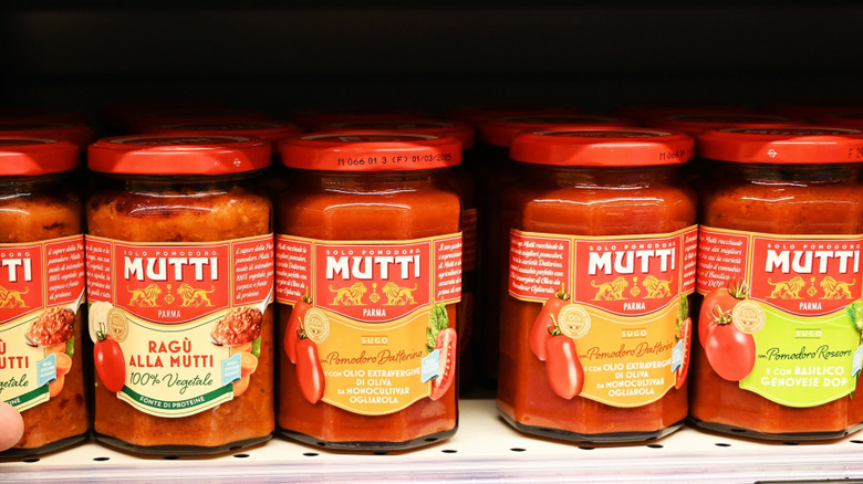 Mutti jarred sauces on a grocery shelf.
