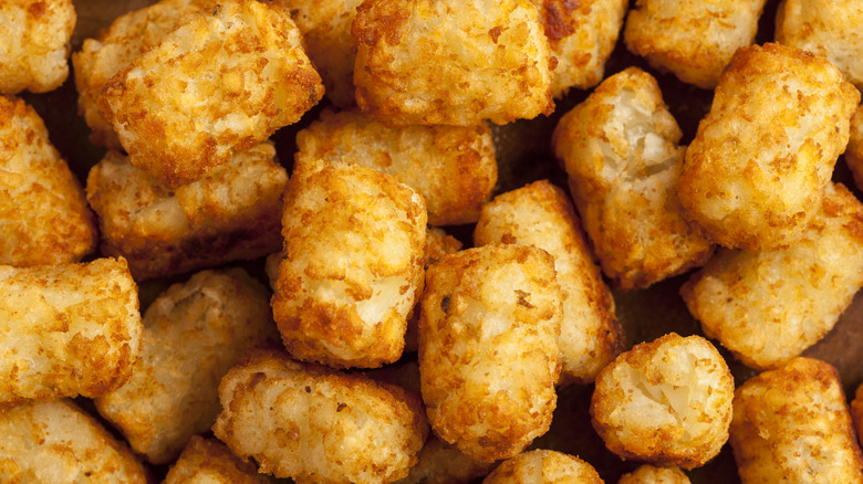 Closeup of pile of fried tater tots