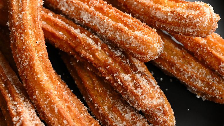 Close up shot of churros covered in sugar