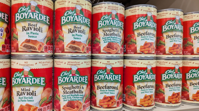 Cans of Chef Boyardee products on grocery shelf