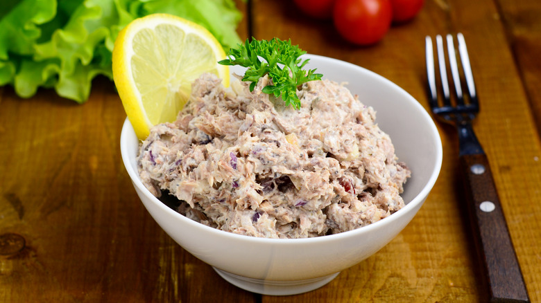 Tuna salad with a slice of lemon.