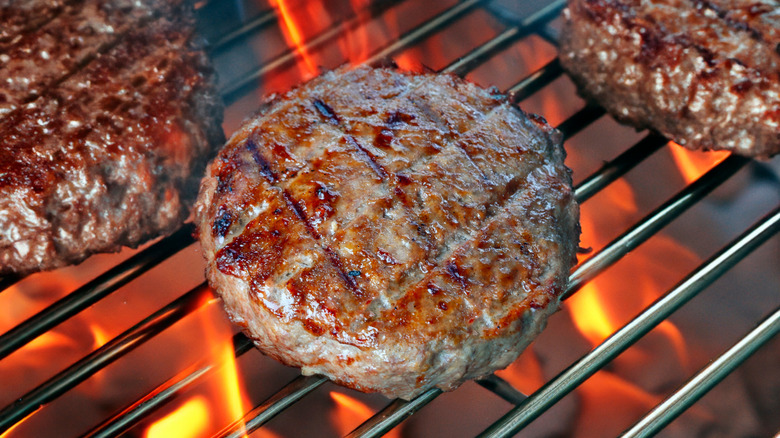 Close-up of beef patties on grill