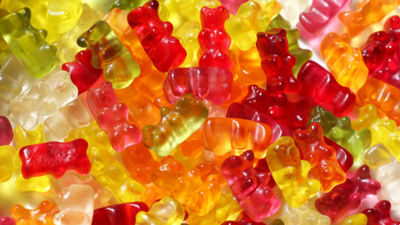 A closeup of a pile of different color gummy bears