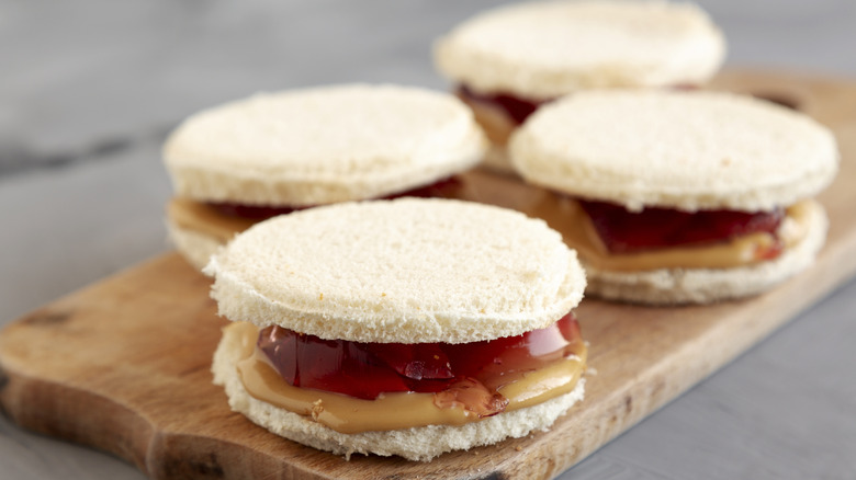 Several crustless peanut butter and jelly sandwiches cut into circles.