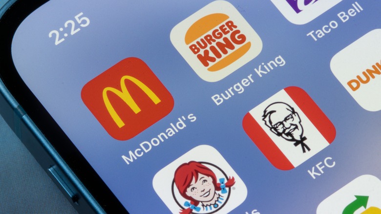 A cellphone with several fast food applications on it.