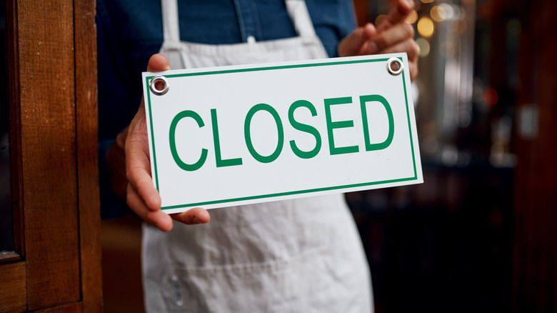 Person with apron holding a 