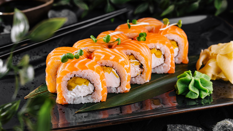 Salmon sushi roll on a bamboo leaf
