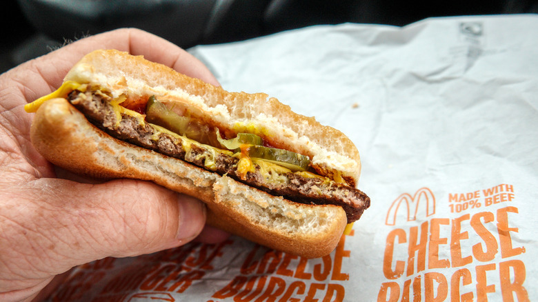 Half eaten McDonald's cheeseburger