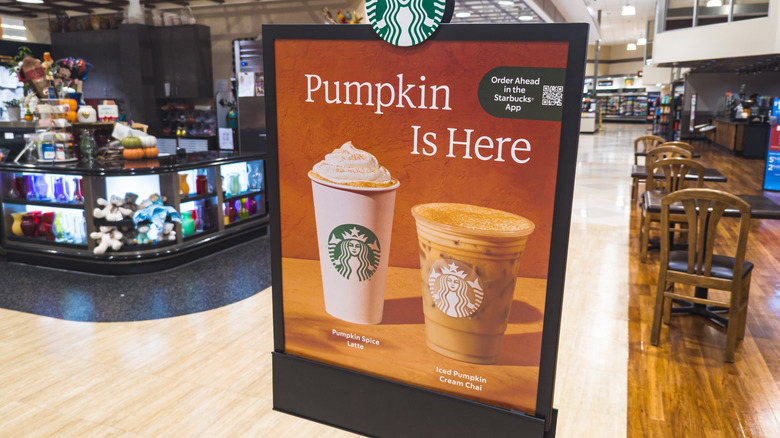 Starbucks Pumpkin Spice Latte sign inside a shopping mart