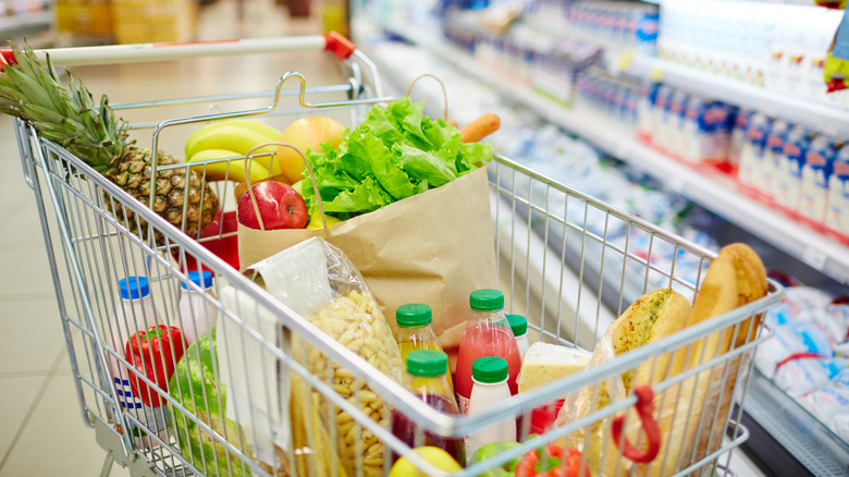 Groceries in a shopping cart at the store.