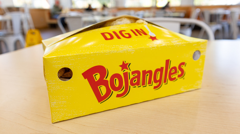 A yellow box of Bojangles take-out food