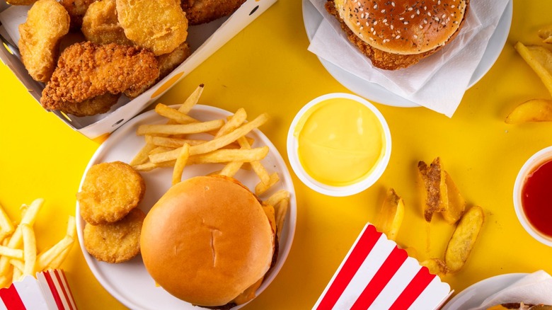 Various fast food items on yellow background
