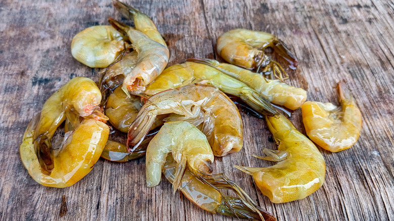 Spoiled shrimp on a wooden surface