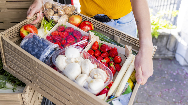 A plastic crate of donated food