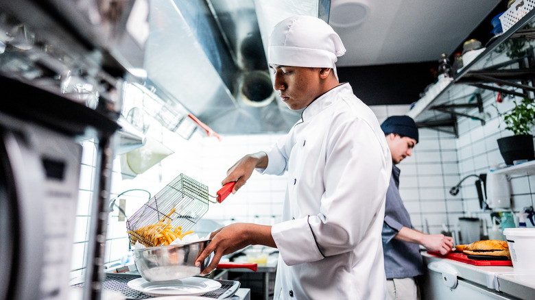 Cooks in a commercial kitchen.