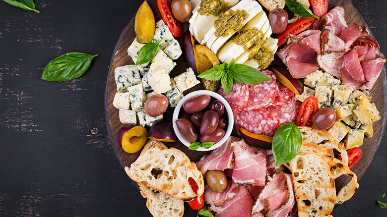 Antipasto tray with assortment of cured meats and cheeses.