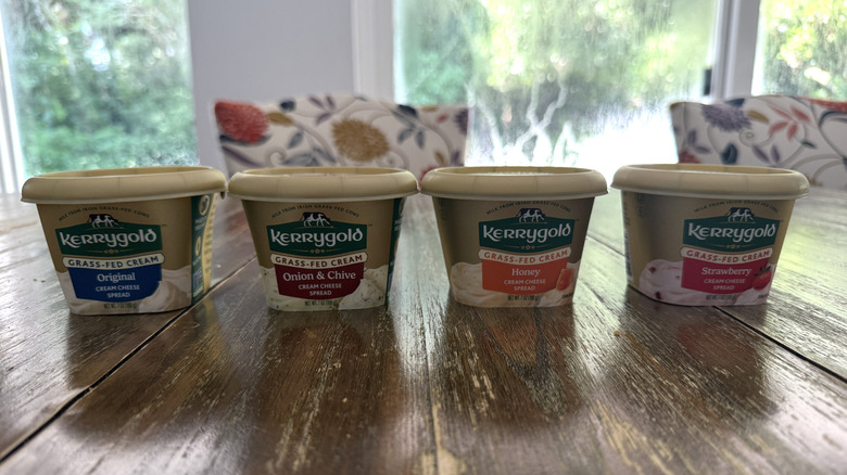 Four Kerrygold cream cheeses on kitchen table.