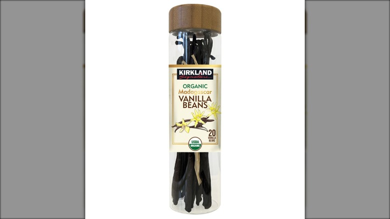Jar of Kirkland Signature Organic Madagascar Vanilla Beans on white background.