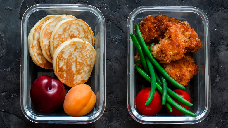 Top view of two containers of lunch food