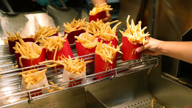 McDonald's french fries portioned into servings on a wire rack