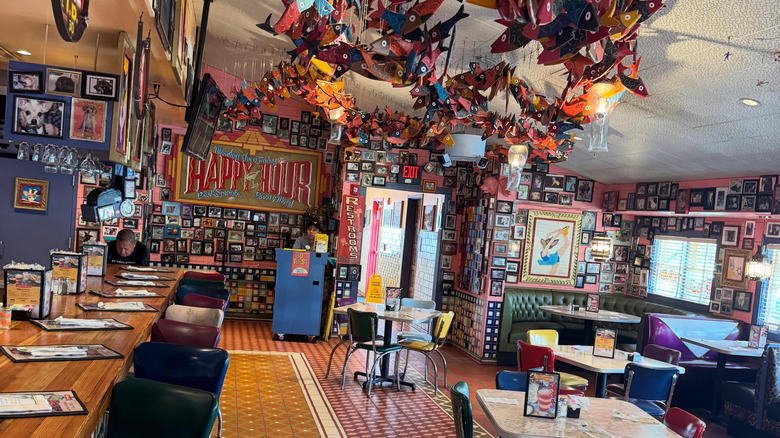 Interior of Chuy's restaurant with funky decor and bar seating