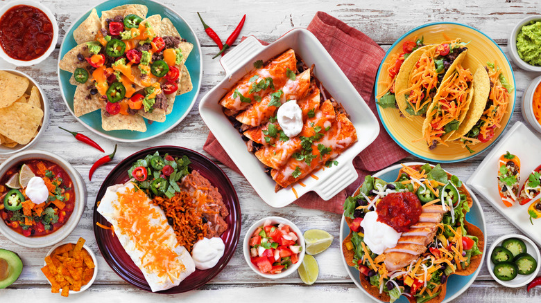 Table top full of Tex-Mex dishes.