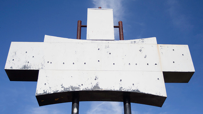 A bare, abandoned fast food sign.