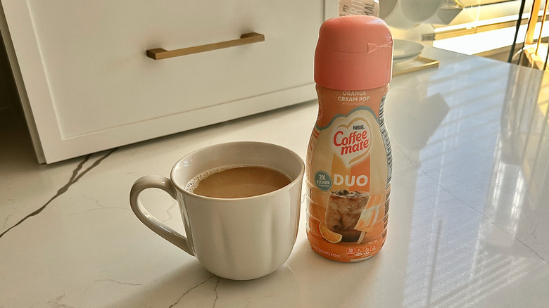 coffee cup and coffee creamer