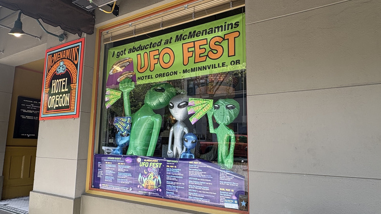 McMenamins UFO Fest decor in a window at the Hotel Oregon